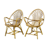A pair of rattan chairs