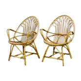 A pair of rattan chairs