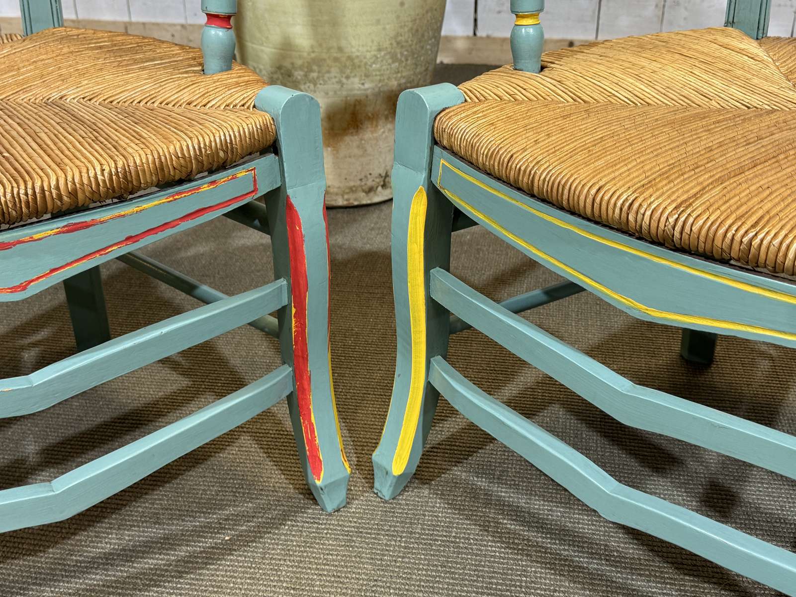 Pair of rustic armchairs in beech with straw seats.