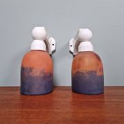Pair of Art Deco wall sconces in multicoloured porcelain and frosted glass.
