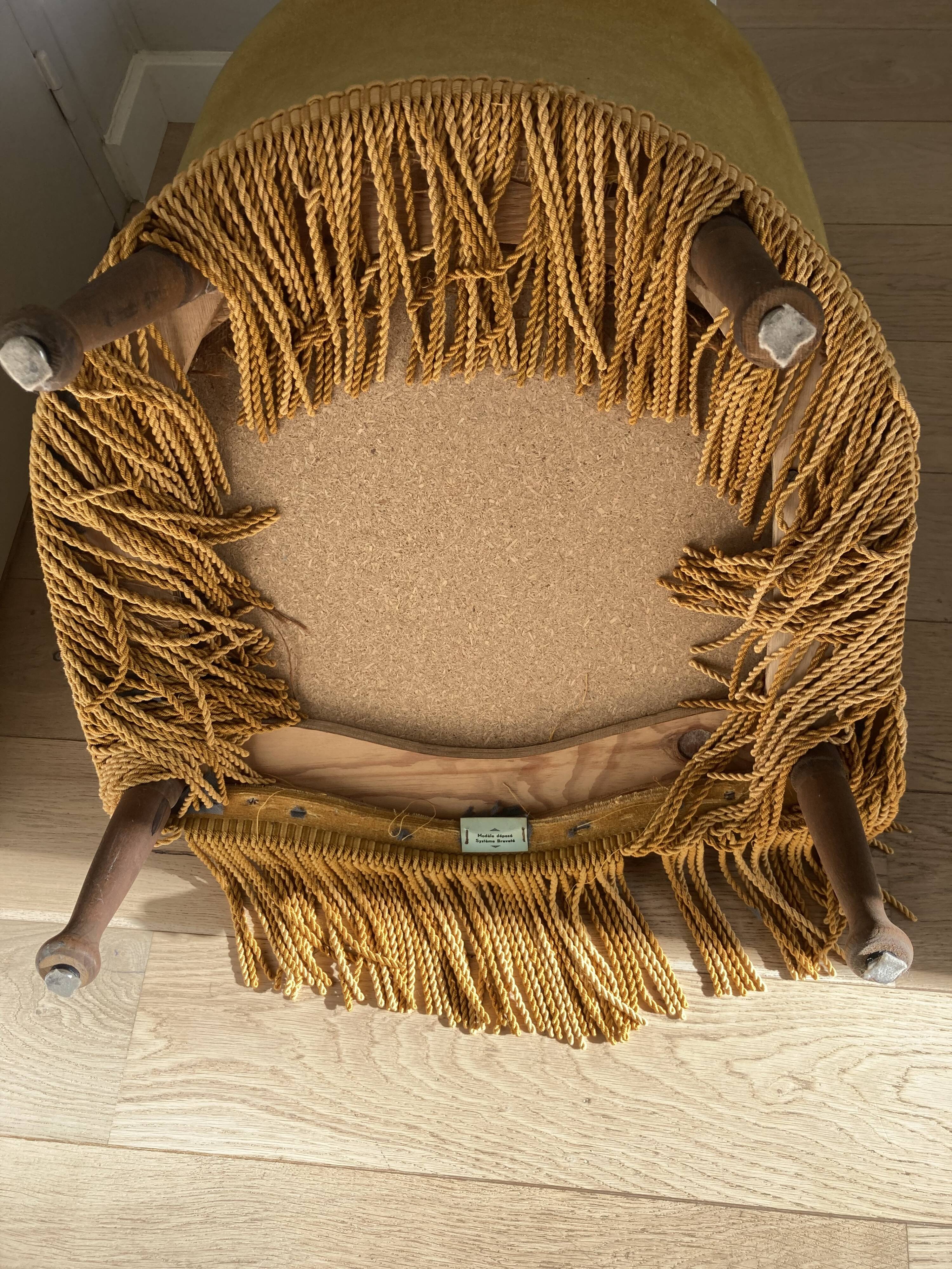 Velvet armchair with fringes