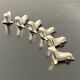6 dolphin-shaped knife holders in silver-colored metal