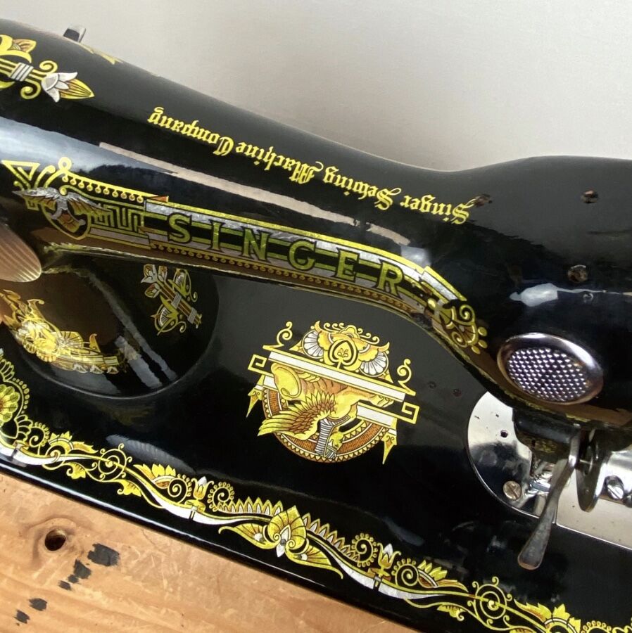 Singer - old sewing machine - black lacquer with golden patterns - very decorative