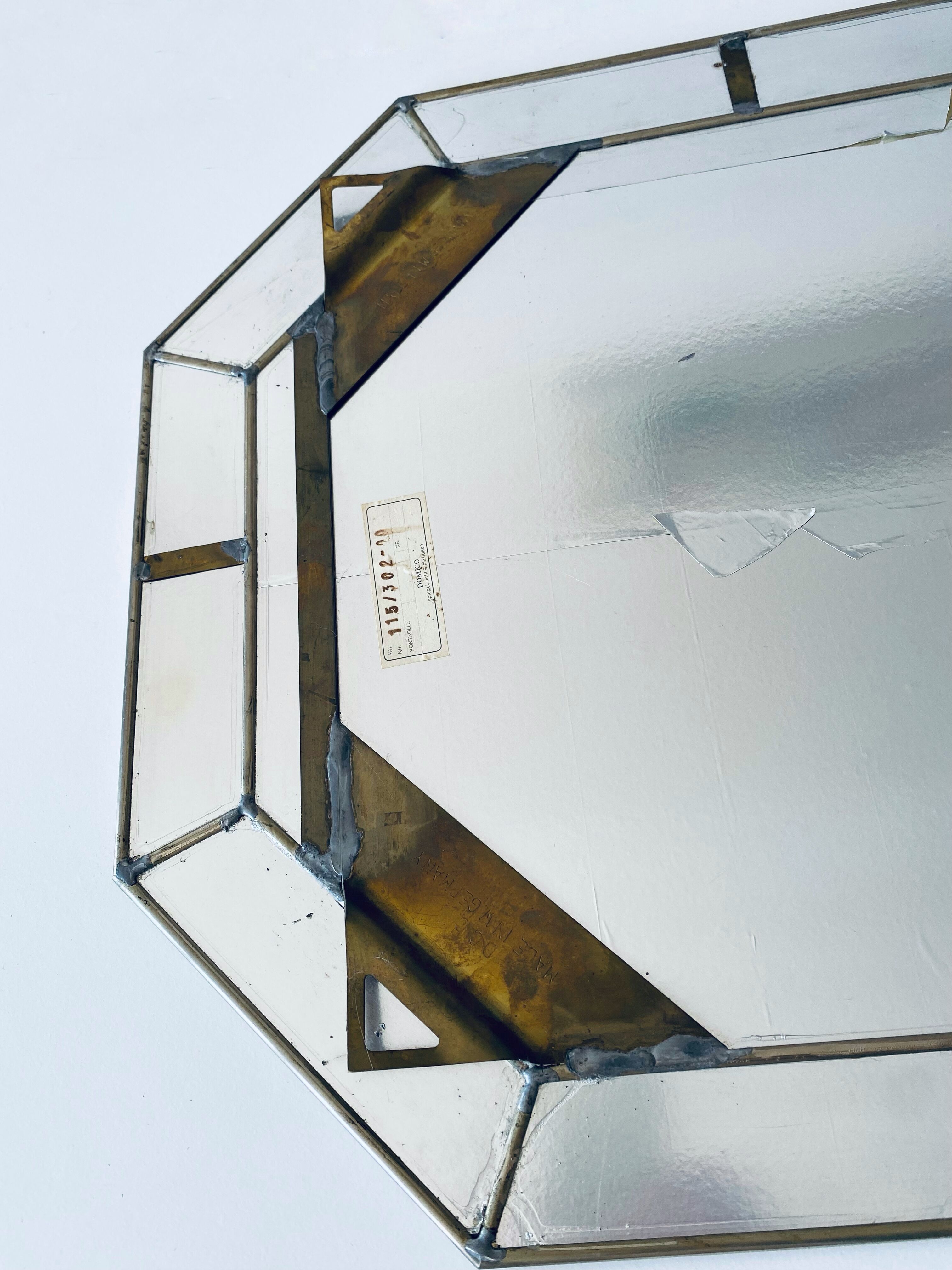 Old octagonal beveled mirror with parcloses