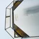 Old octagonal beveled mirror with parcloses