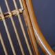 Vintage rocking chair in rattan from the 60s-70s, high openwork backrest.