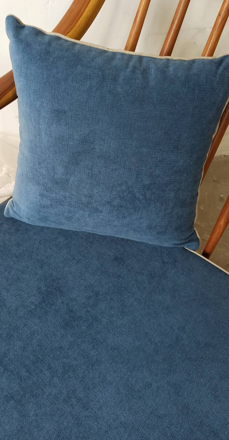 Pair of cozy teak armchairs with cushions