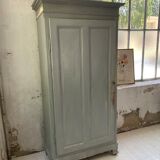 Blue patinated cap cabinet
