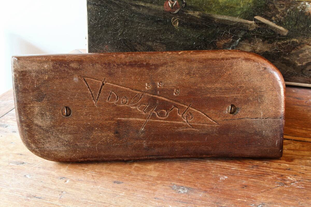 Pair of Art Deco carved wood candlesticks, signed Delaporte