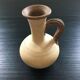 Trio of terracotta vases