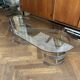 Table basse ovale design années 70 en verre et pieds chromé « S »