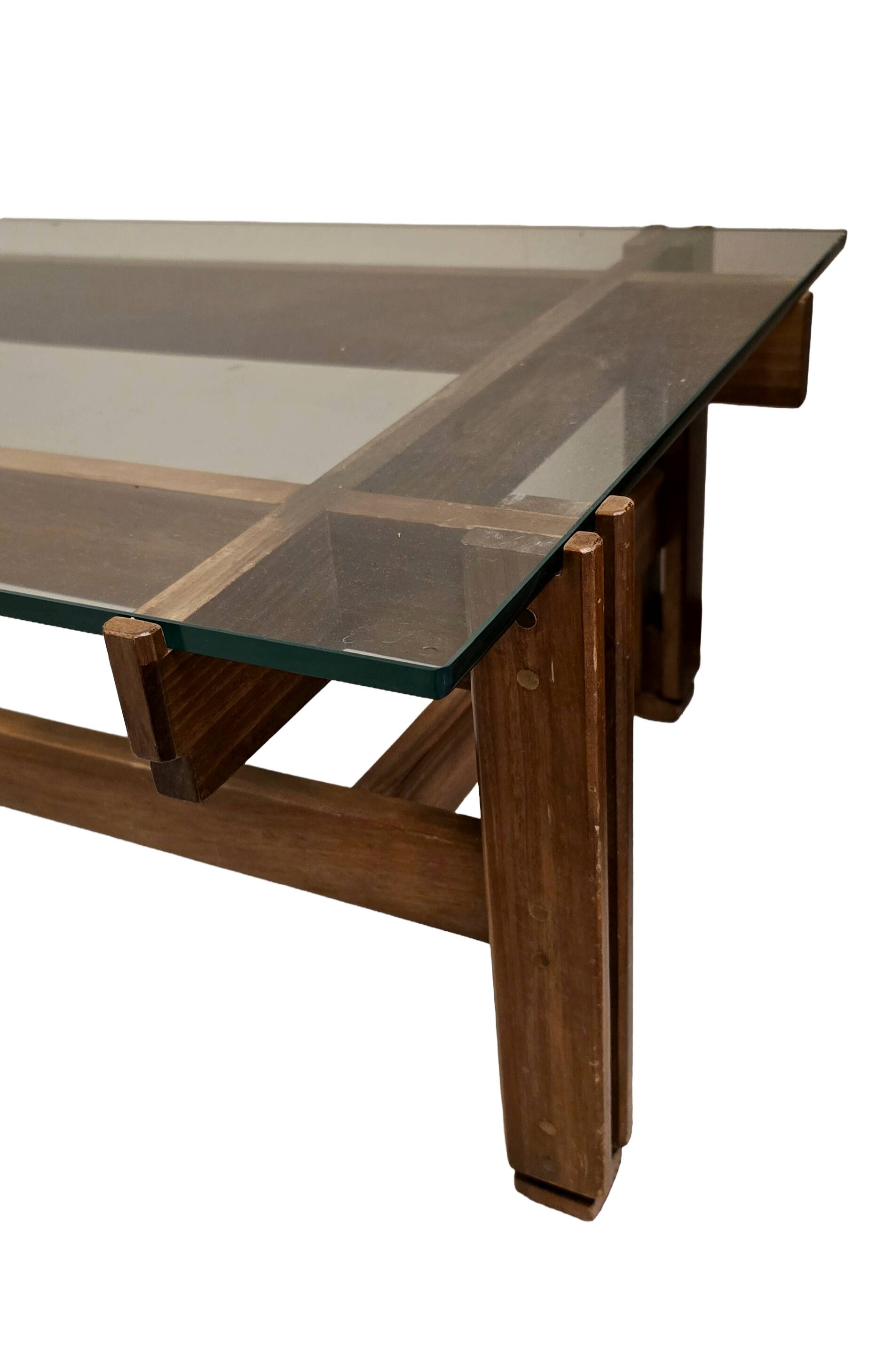 Glass coffee table with a wooden frame.