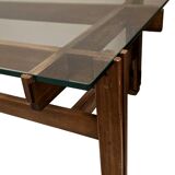 Glass coffee table with a wooden frame.