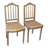 Pair of Louis XVI caned chairs with carved gilded wood.