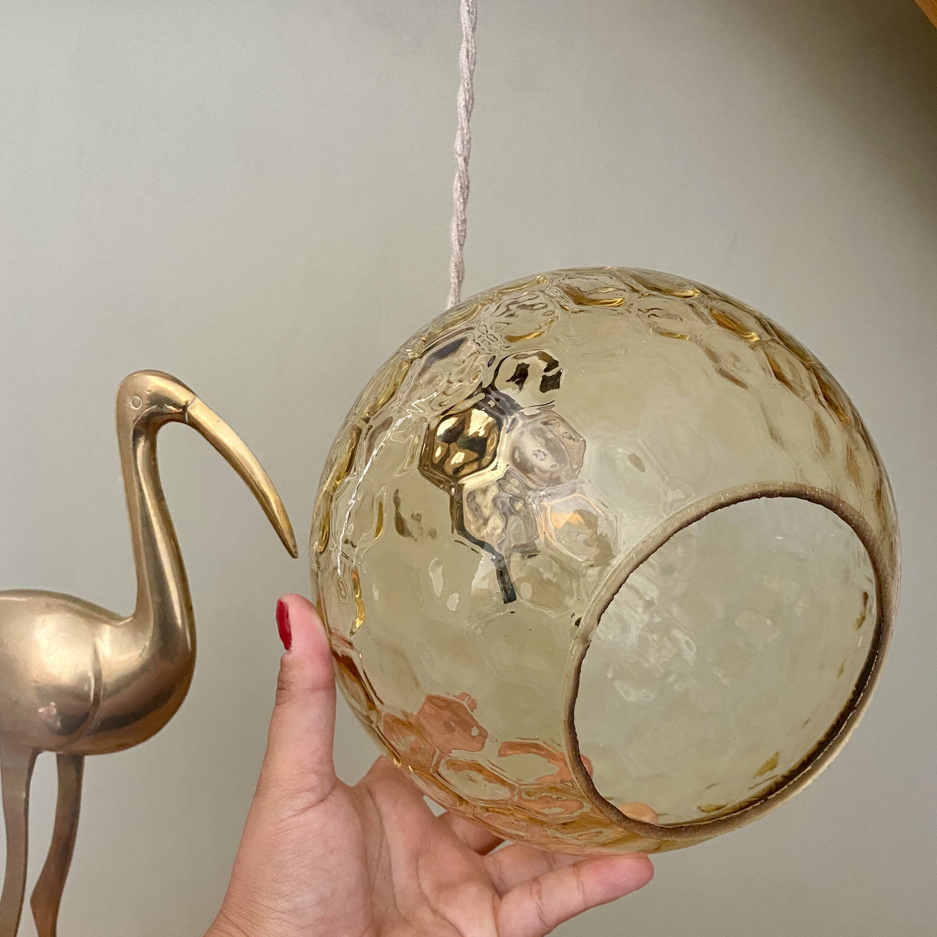 Vintage globe pendant light in amber glass