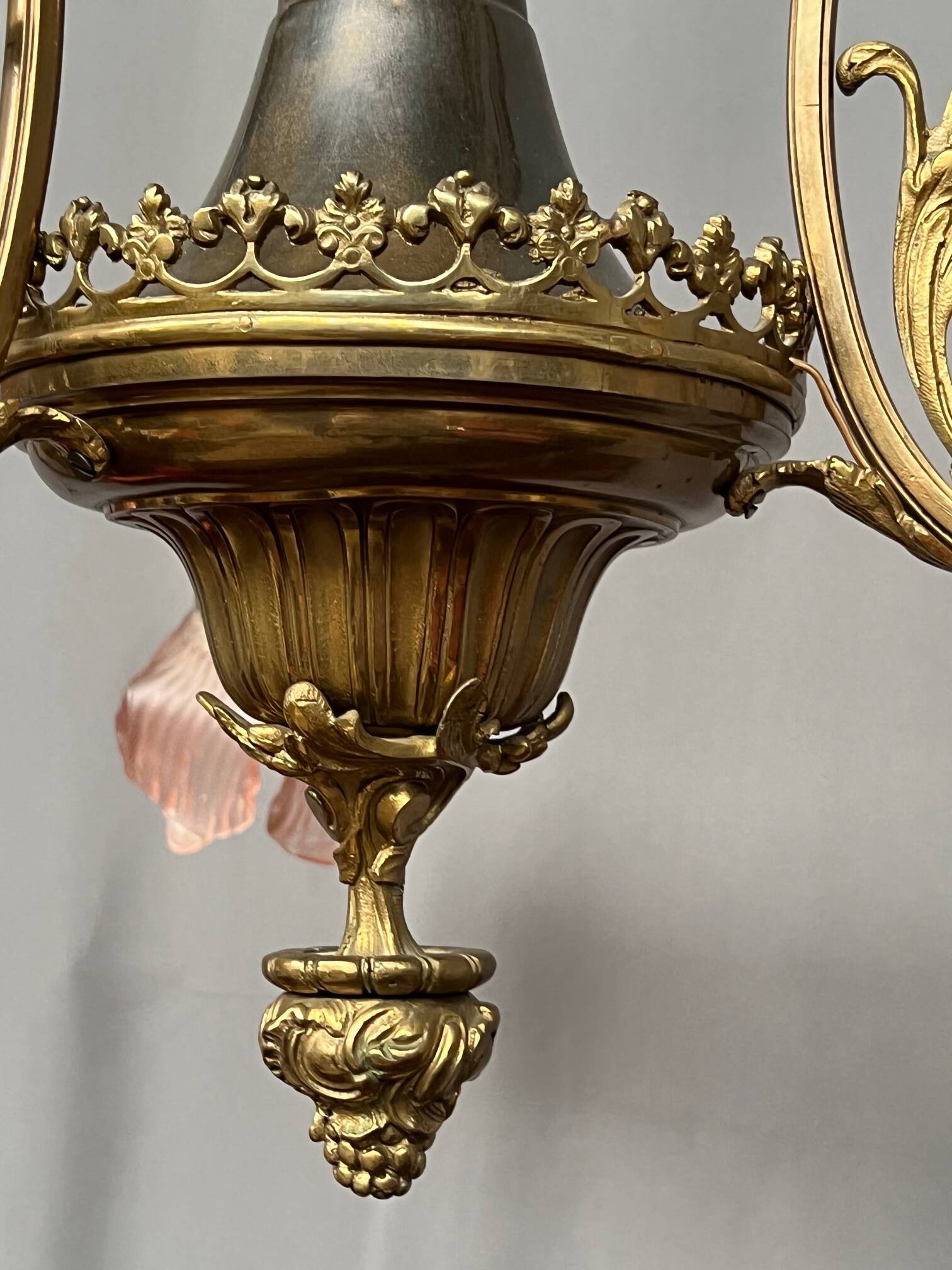 Renaissance chandelier with putti statuette.