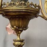 Renaissance chandelier with putti statuette.
