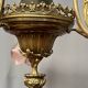 Renaissance chandelier with putti statuette.