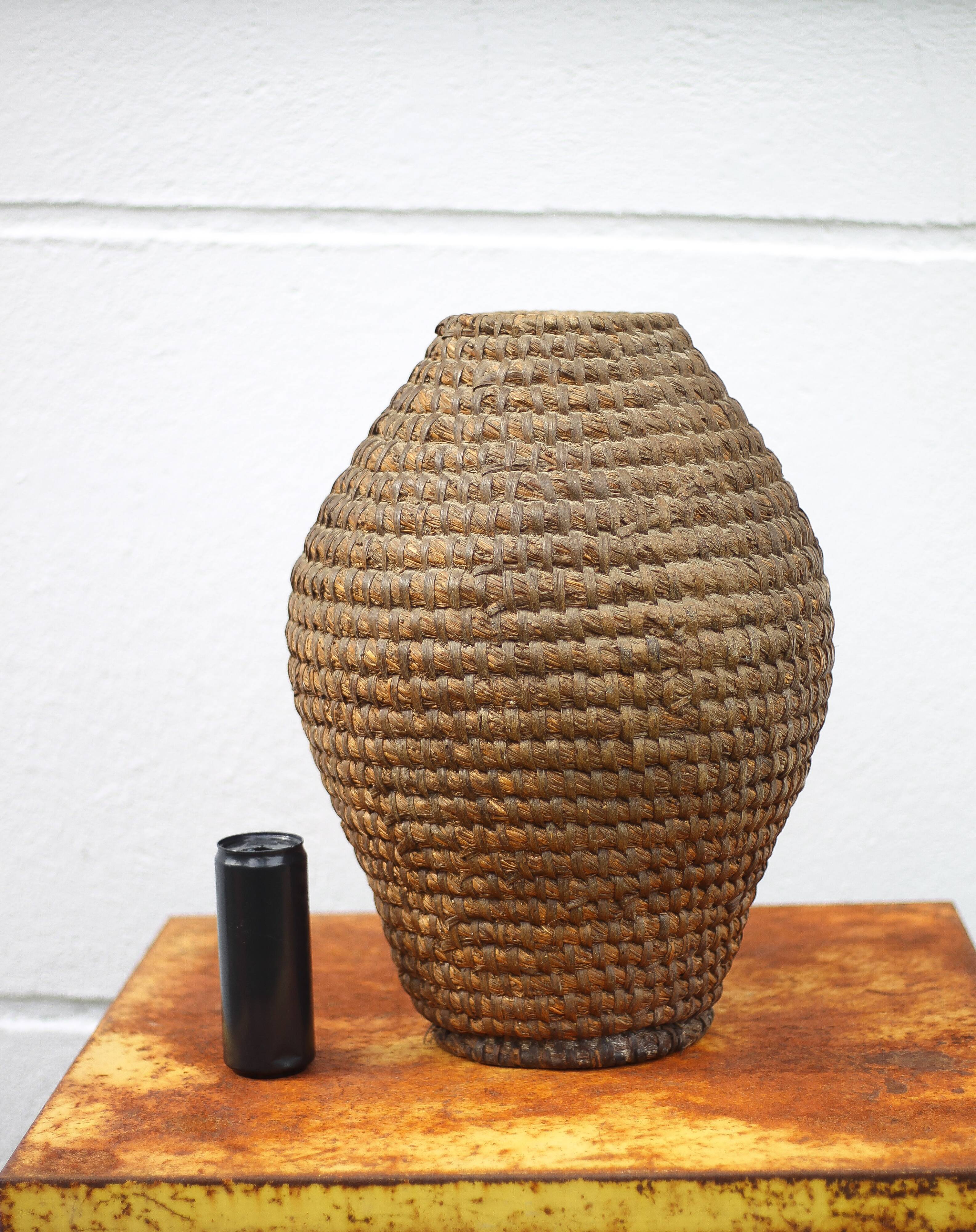 Old basket, burgundy straw and bramble, woven basket, interior decoration