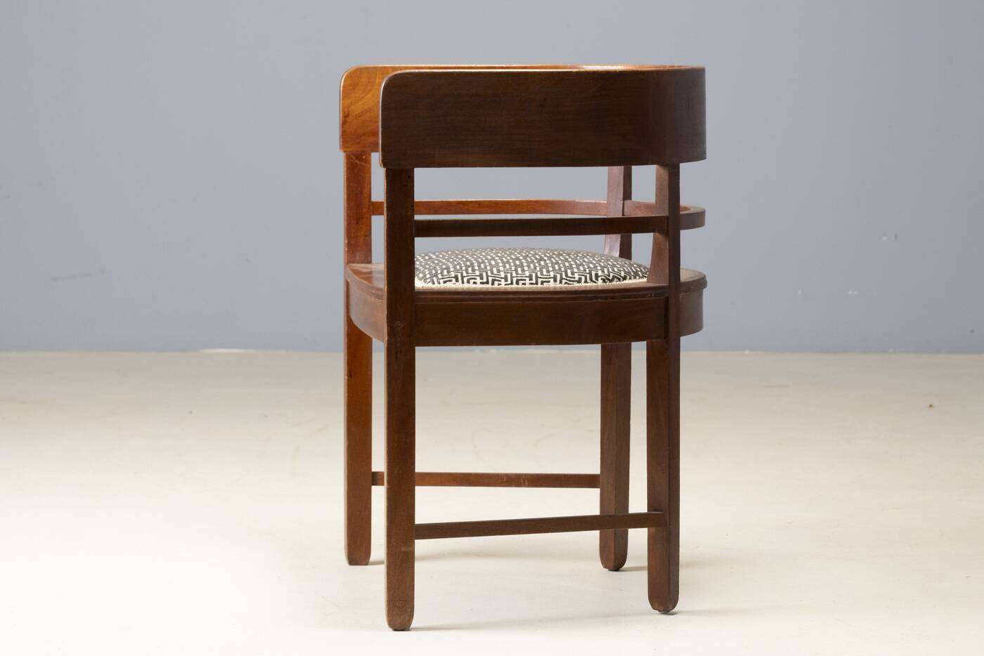 Central European armchair from the early 20th century with an inlaid backrest.