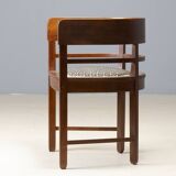 Central European armchair from the early 20th century with an inlaid backrest.