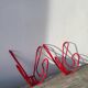 Pair of red metal wall hooks