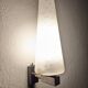 Modernist wall light in glass and brass by Maison Arlus, France circa 1950.