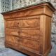 French antique walnut commode with a dark grey marble top, circa 1830–1860.