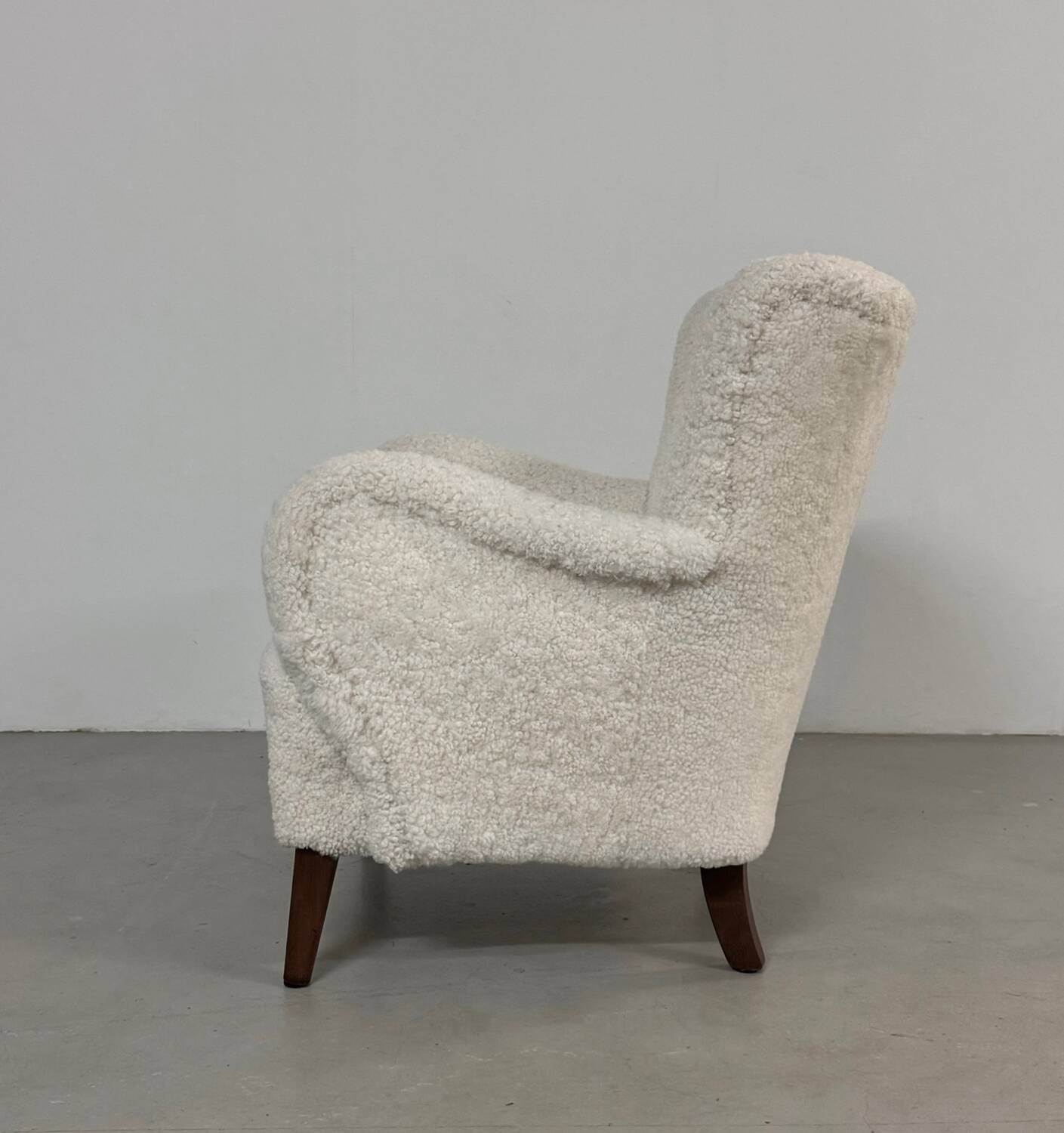 Danish lounge chair with new curly fur upholstery