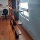 Asymmetrical wall or divider bookcase in dark wood