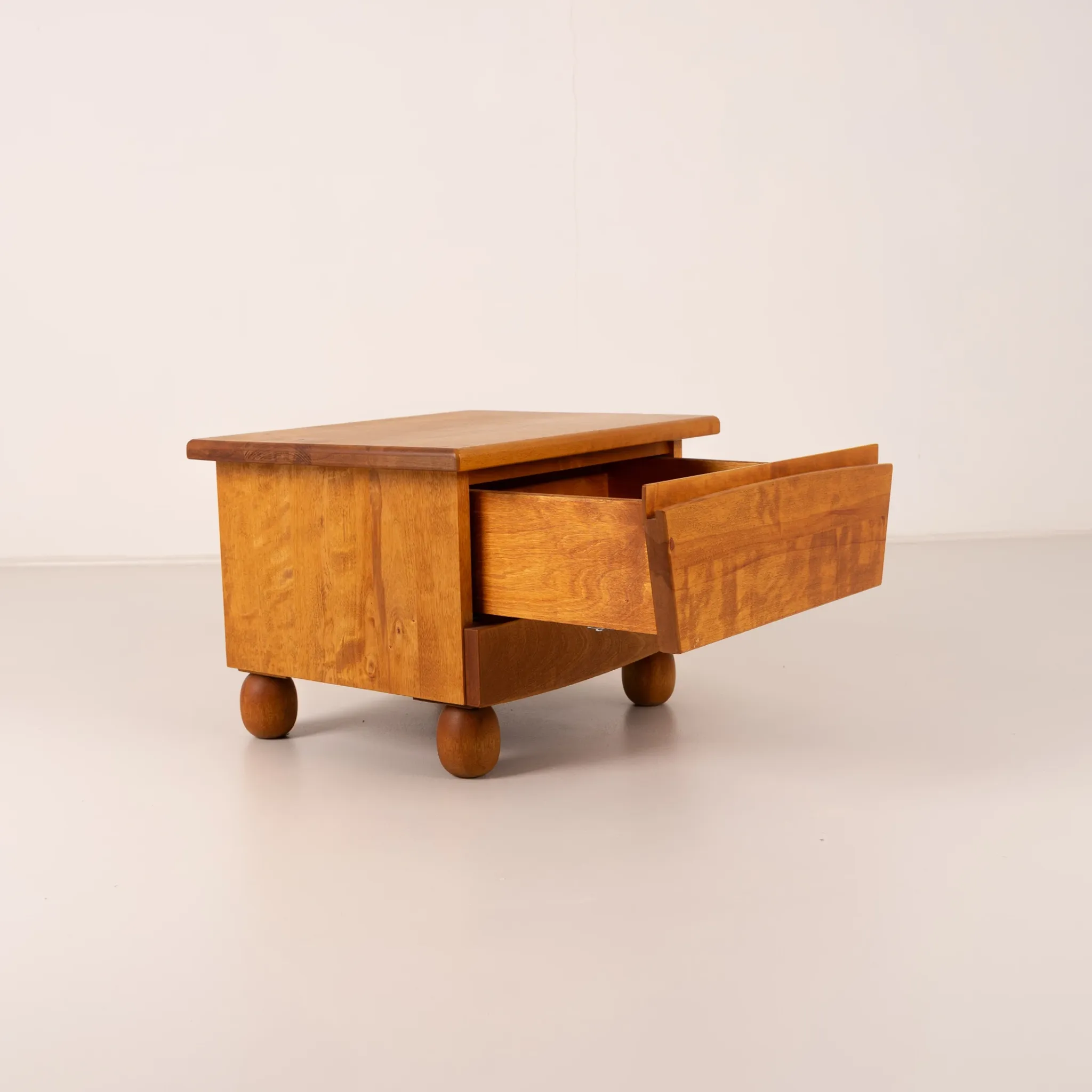 Pair of wooden bedside tables with rounded feet