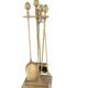 Brass fireplace tools in the style of Maison Baguès.