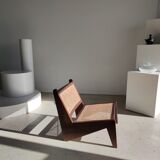 Reclined armchair in canned teak in natural wood