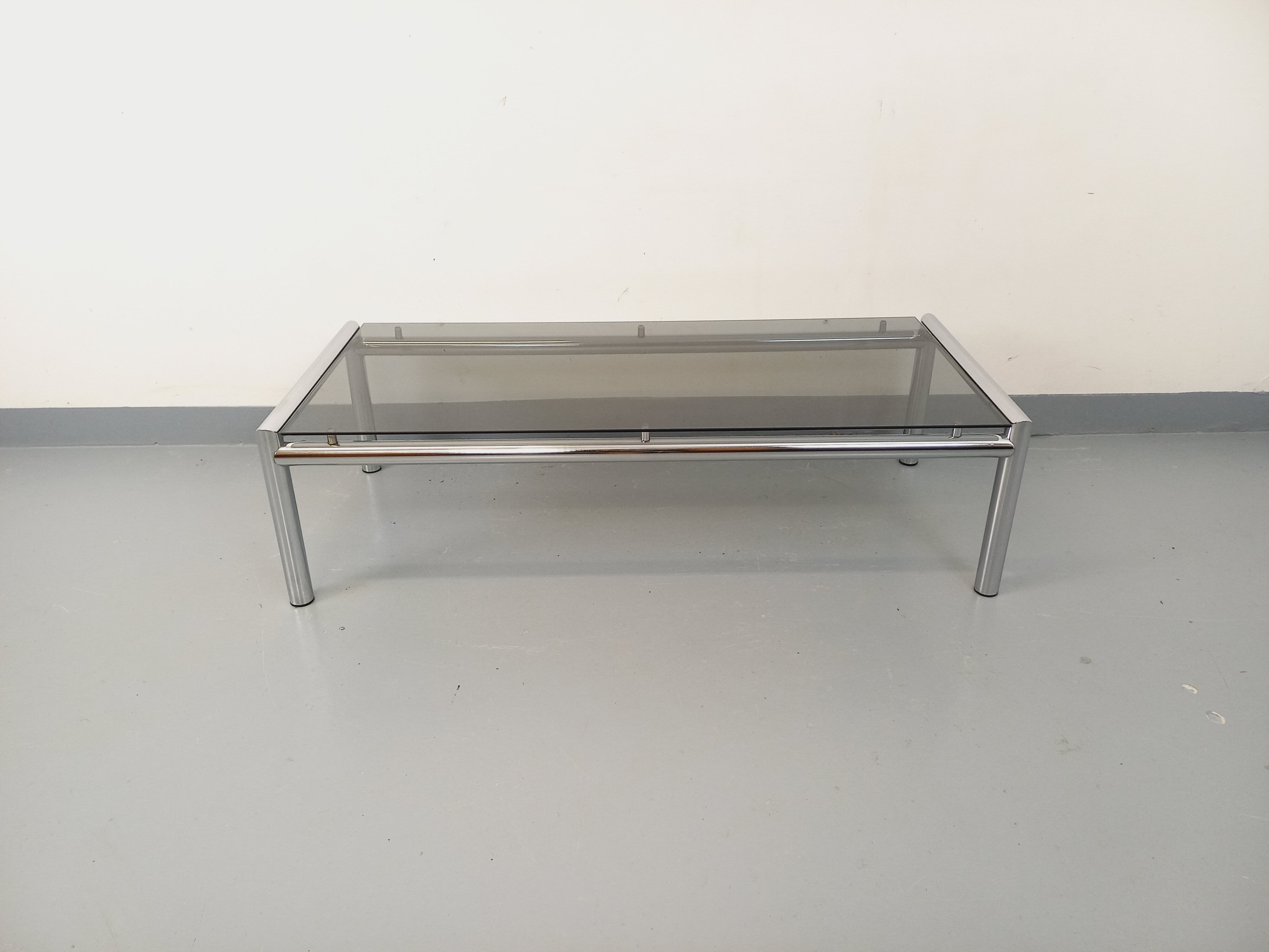 Vintage rectangular coffee table in smoked glass and chrome metal from the 1960s.