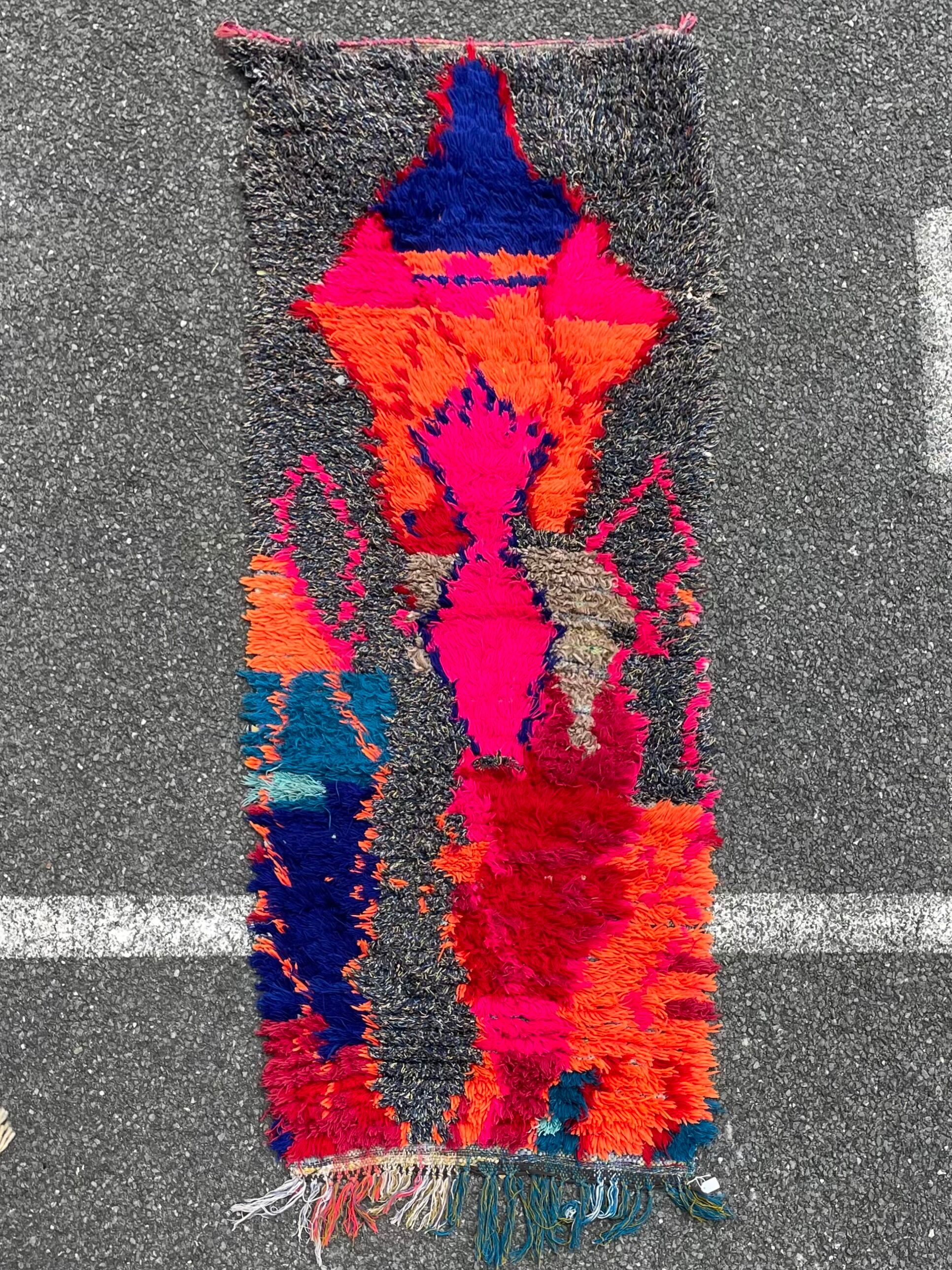 Modern red berber carpet in boucherouite fabrics