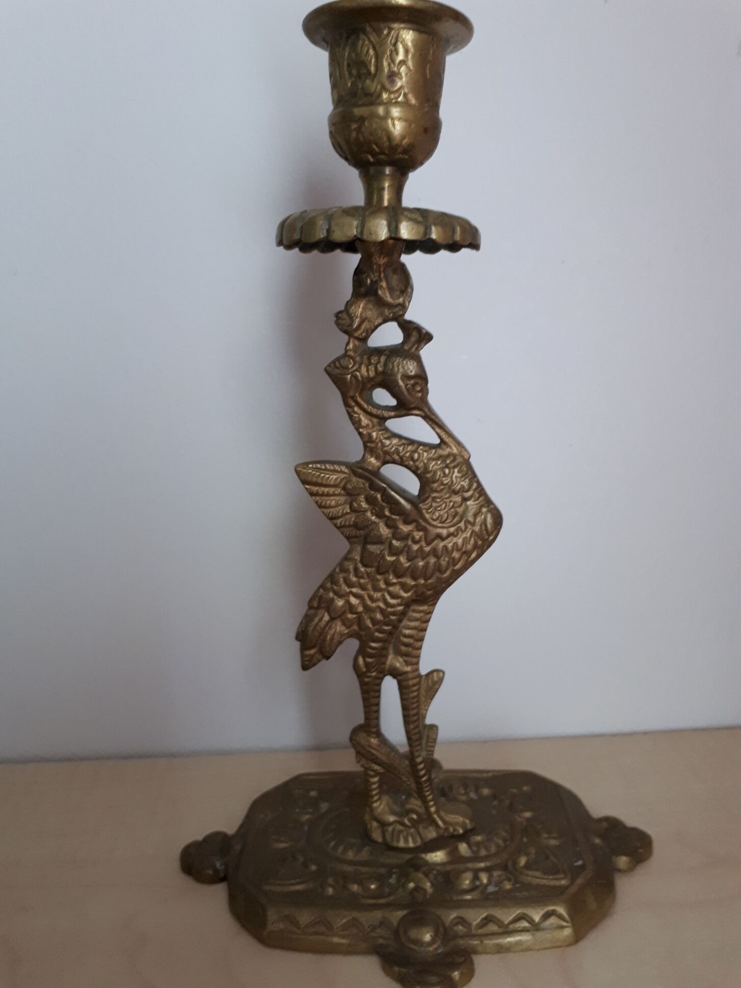 Pair of bronze candle holders decorated with herons