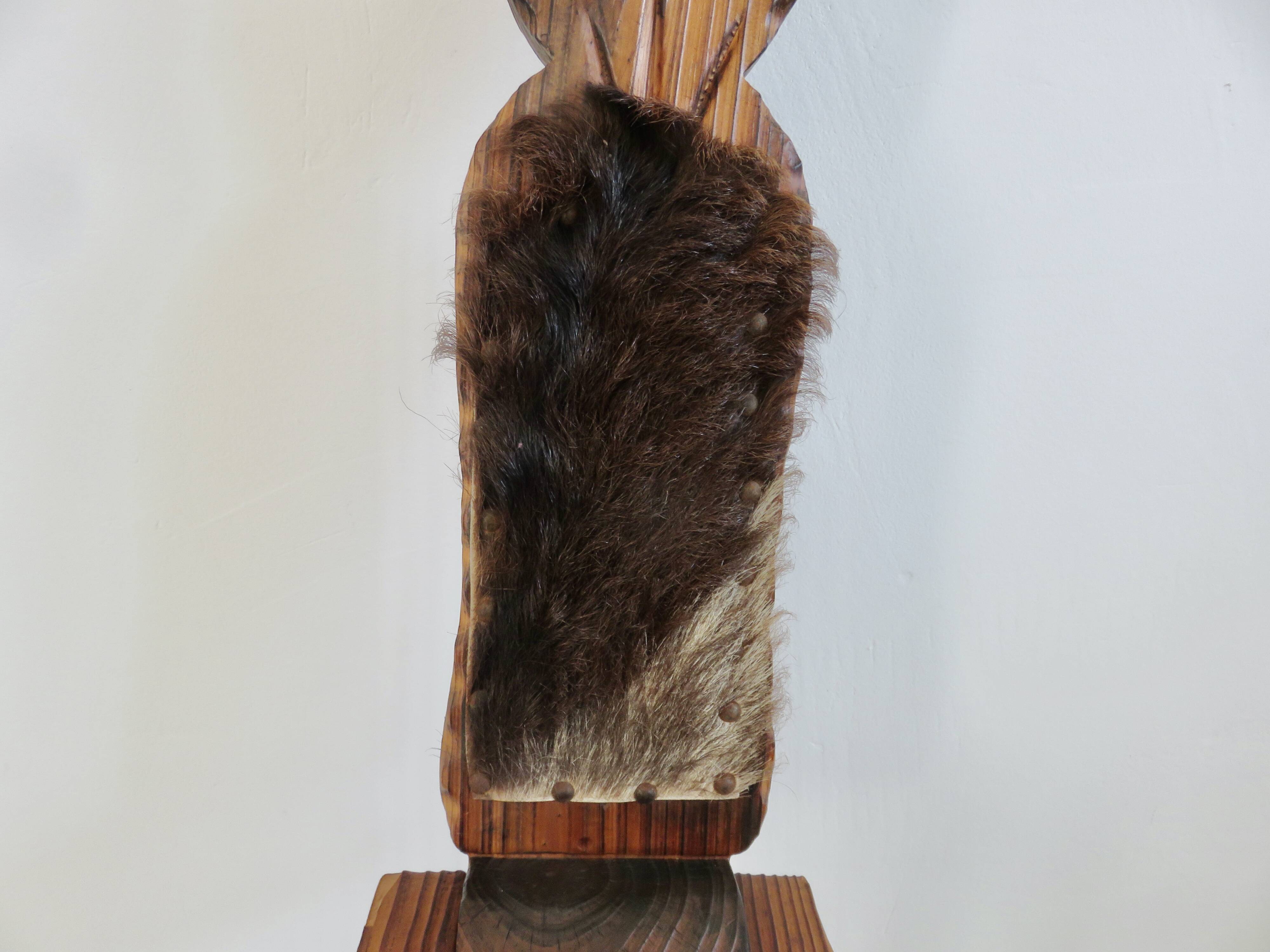 Brutalist cowhide tripod stool in solid wood