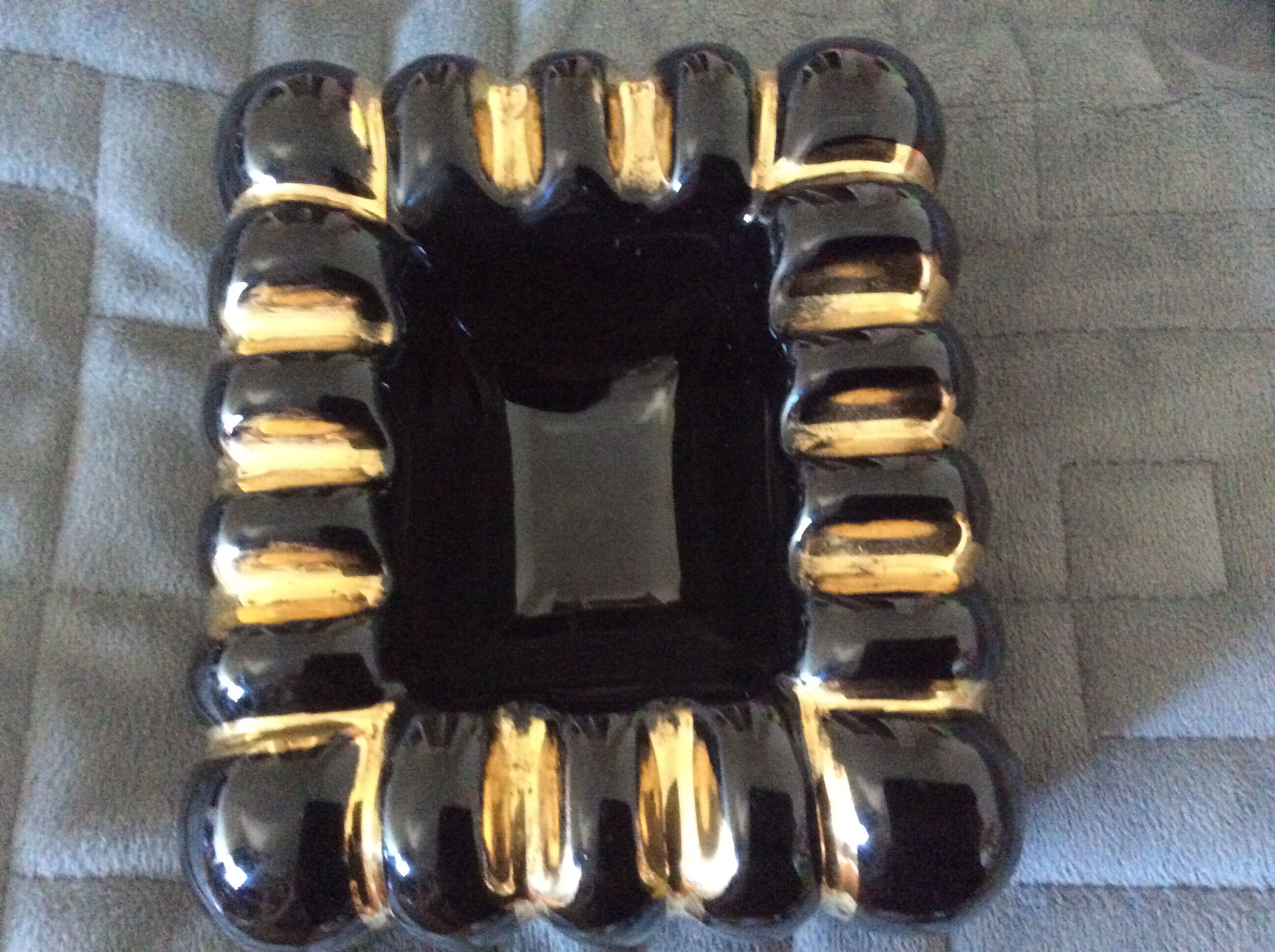 Black ashtray and ceramic gold 50s