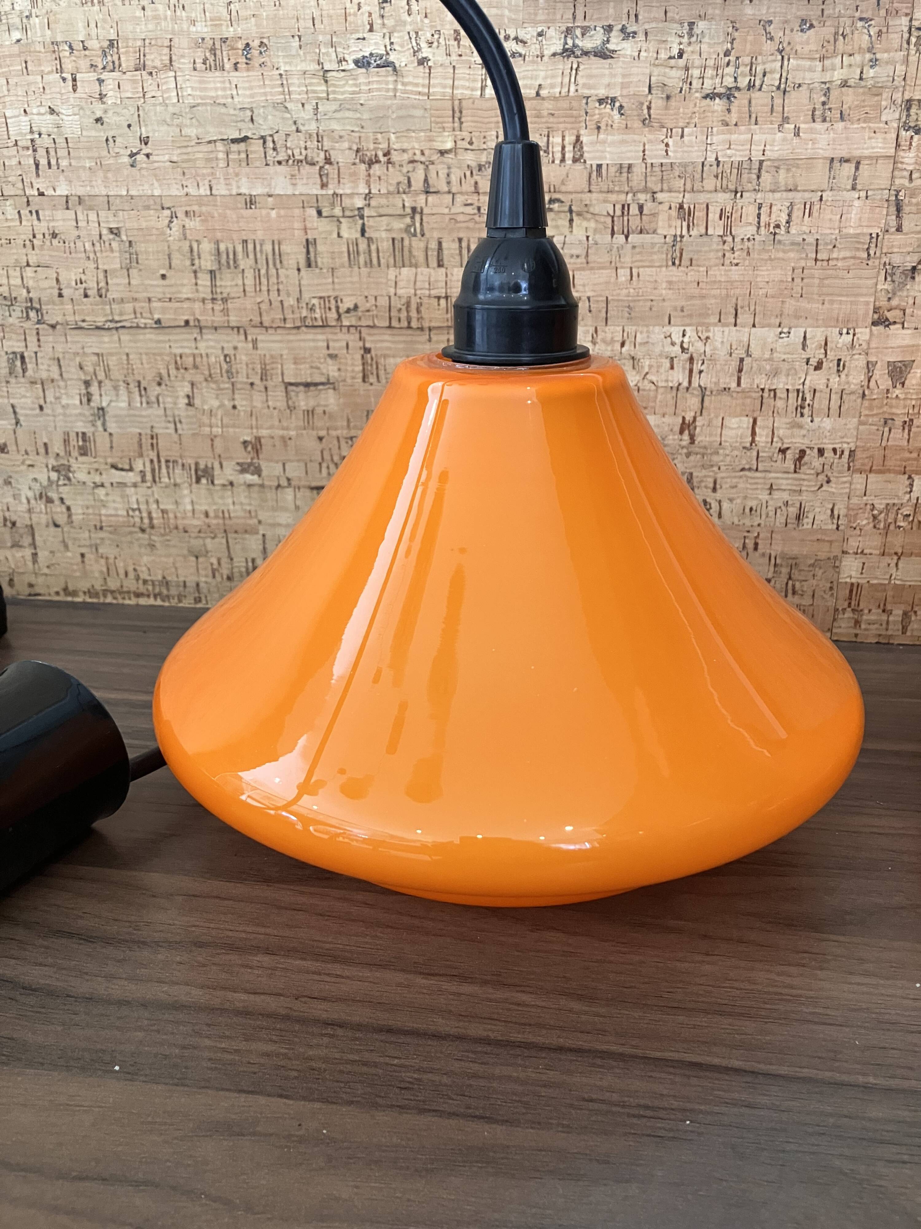 Set of three orange opaline suspensions from the 1970s Space Age.