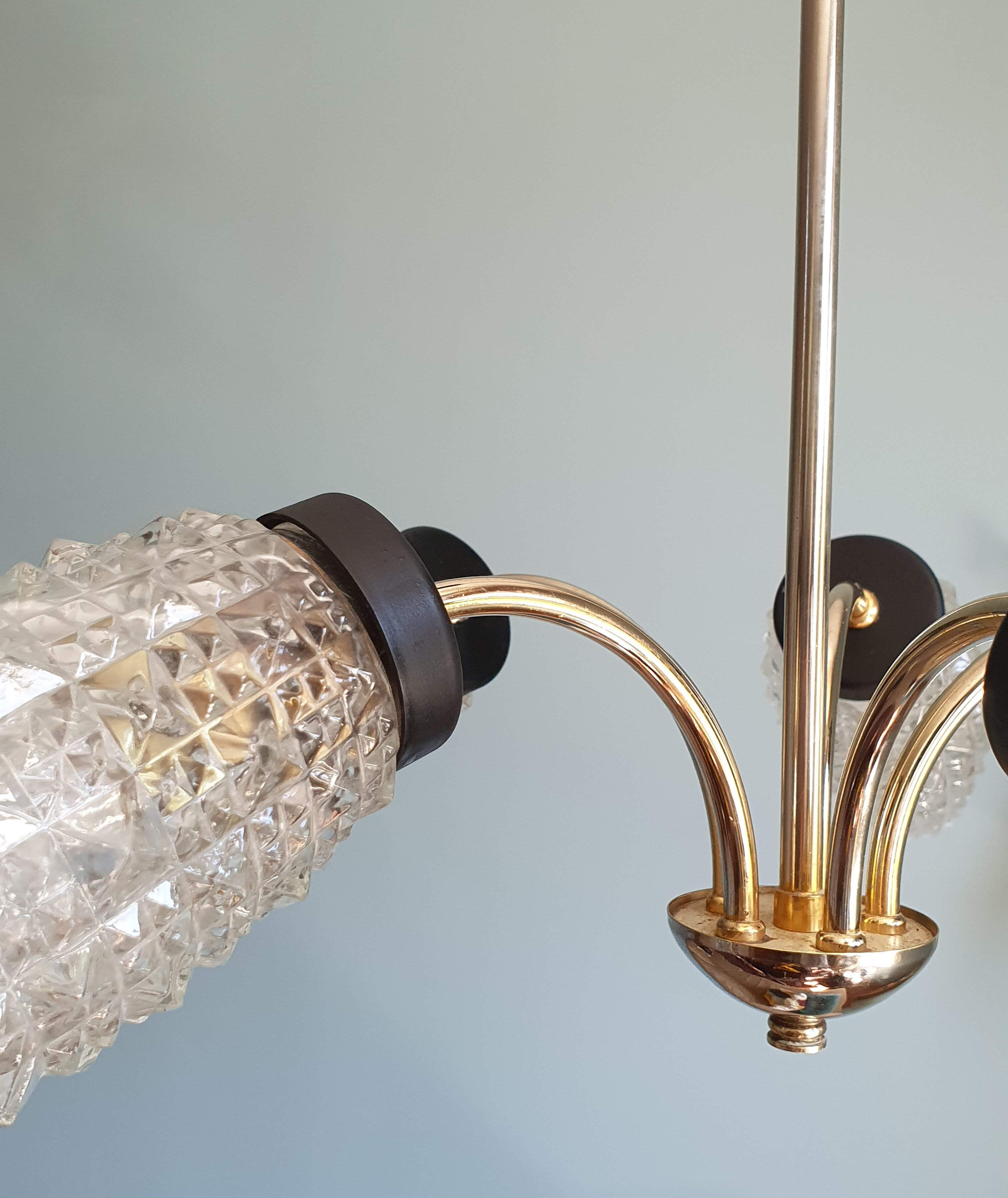 Vintage chandelier in brass and glass