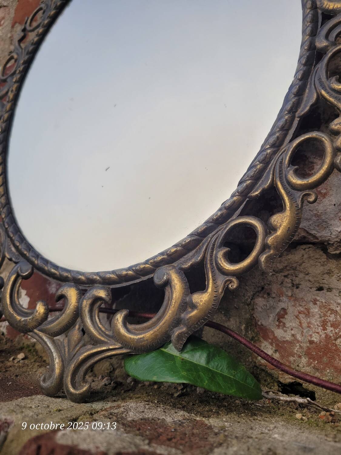 2 antique oval mirrors in heavy metal