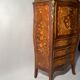 Secrétaire galbé et marqueté de branchages fleuris de style Louis XV