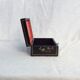 Old black wooden box adorned with roses with keys
