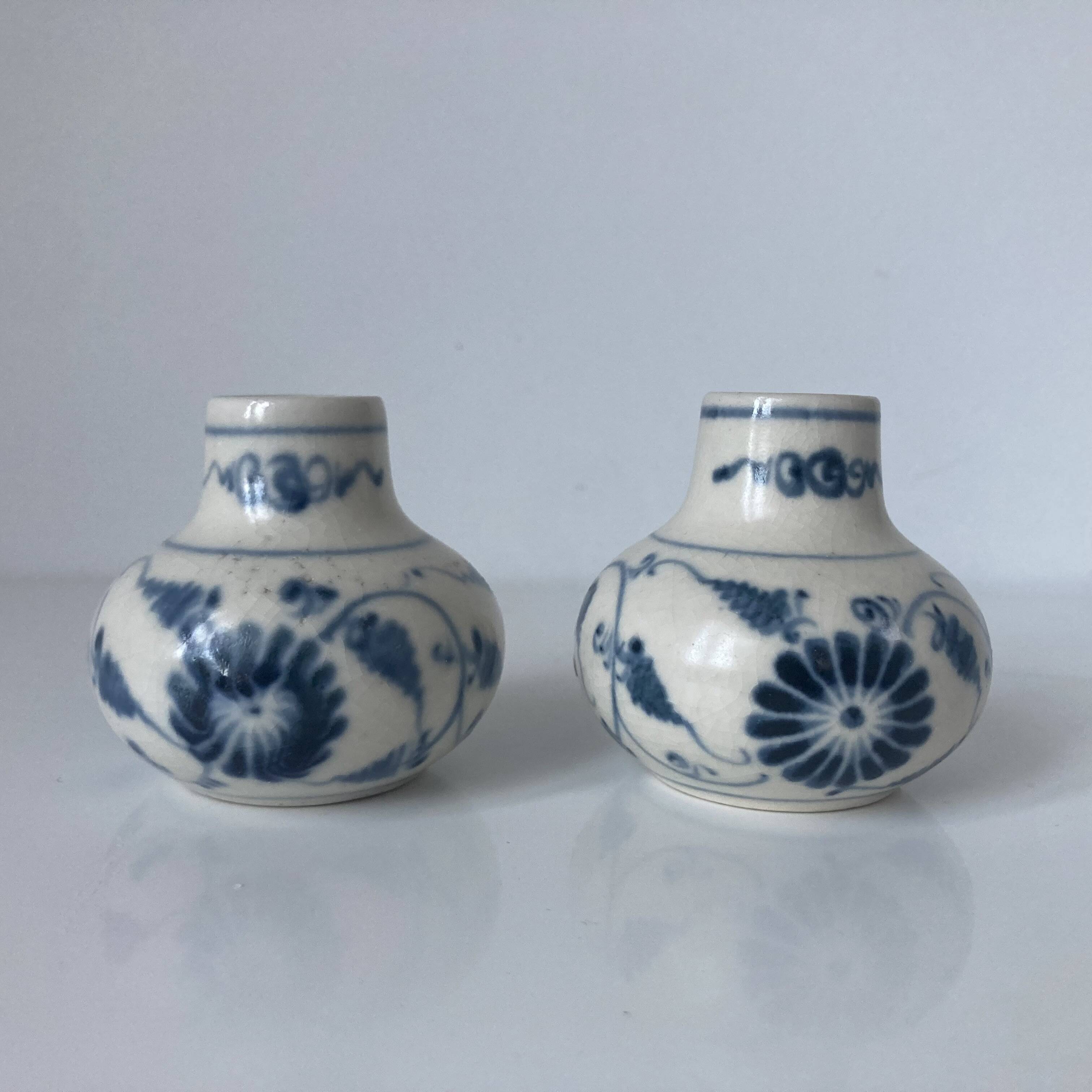 Pair of miniature blue and white Vietnamese ceramic vases with floral decoration.