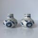 Pair of miniature blue and white Vietnamese ceramic vases with floral decoration.