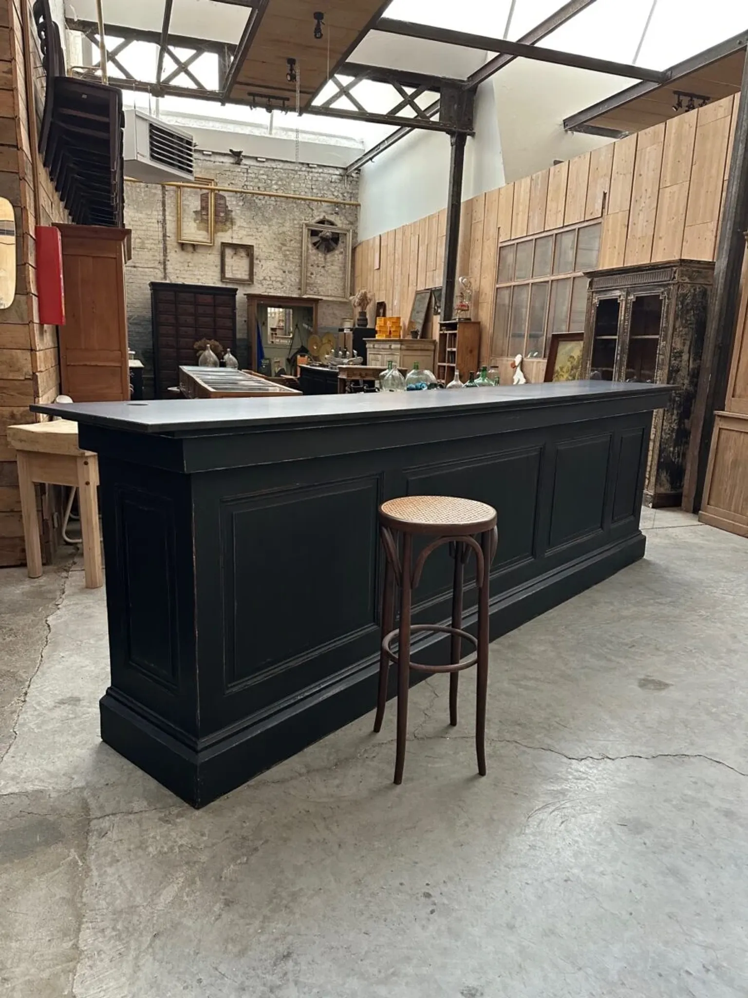 Immense bar counter covered with blue stone.