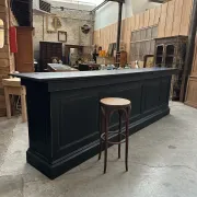 Immense bar counter covered with blue stone.