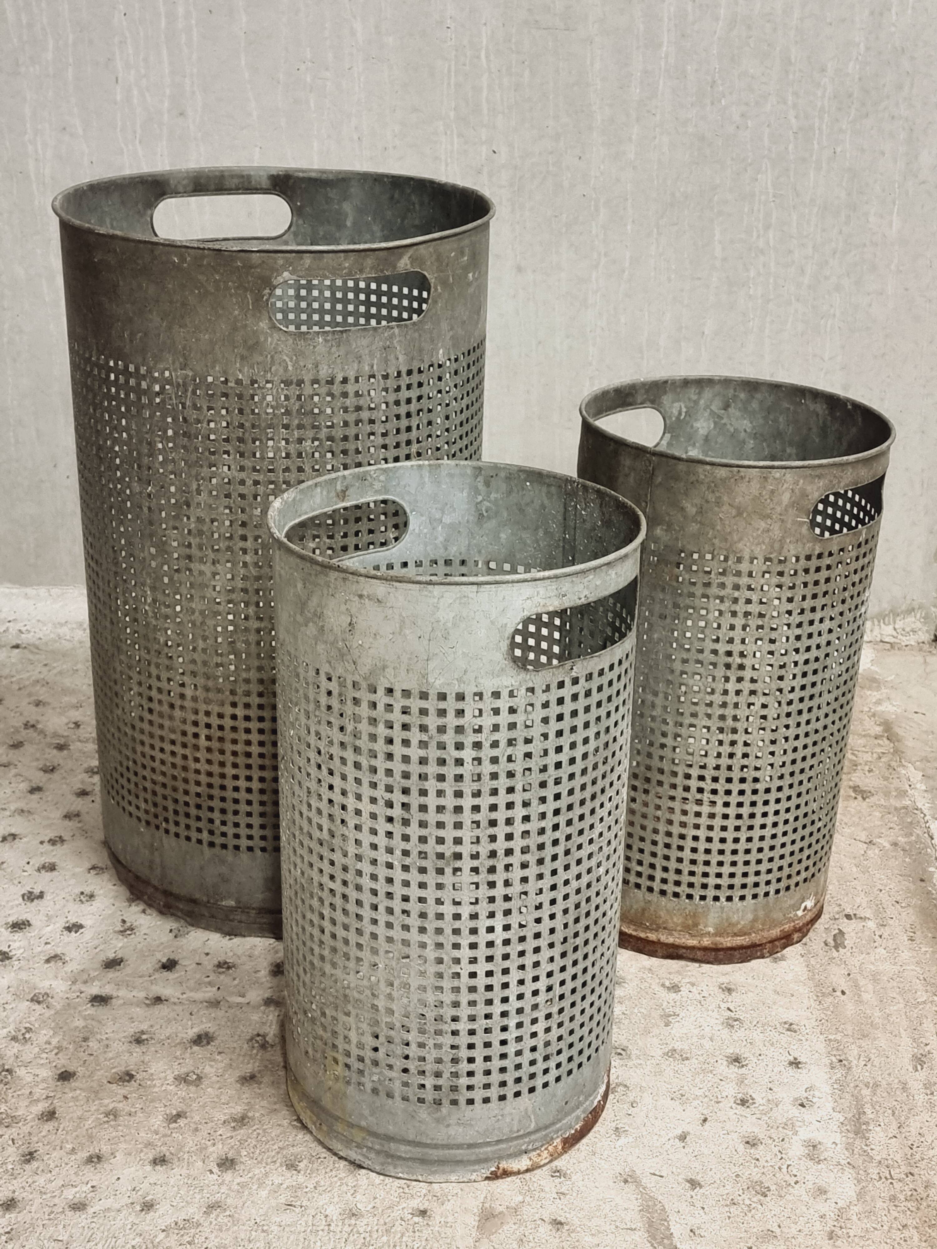 Vintage set of perforated metal waste bins