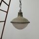 Patinated metal and glass Holophane pendant light