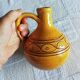 Round ochre glazed jug with handle